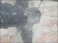 Detailní pohled na zazděný trámek v komíně a místo vzniku požáru